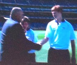 Moonee Valley's Peter Wright receives his Under 15 Victorian cap from Test cricket legend Merv Hughes